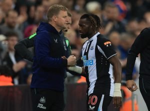eddie-howe-and-allan-saint-maximin-embrace-during-a-premier-league-game-between-newcastle-united-and-arsenal-2022